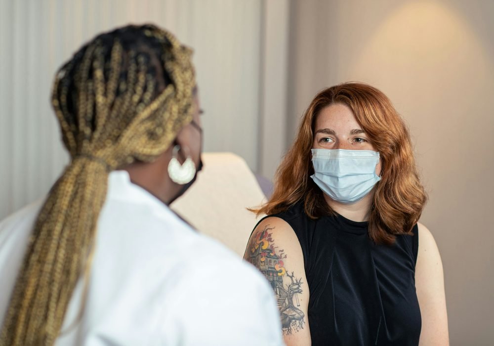A clinician talking with a patient during an assessment