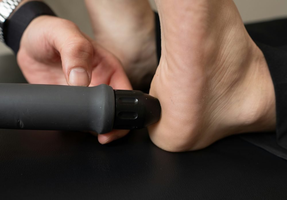 Close-up of a patient receiving treatment on the heel