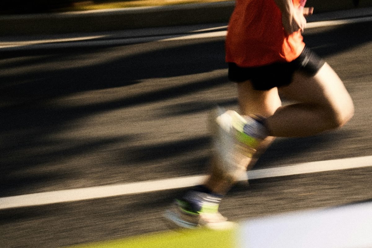 Runner mid-stride on a street