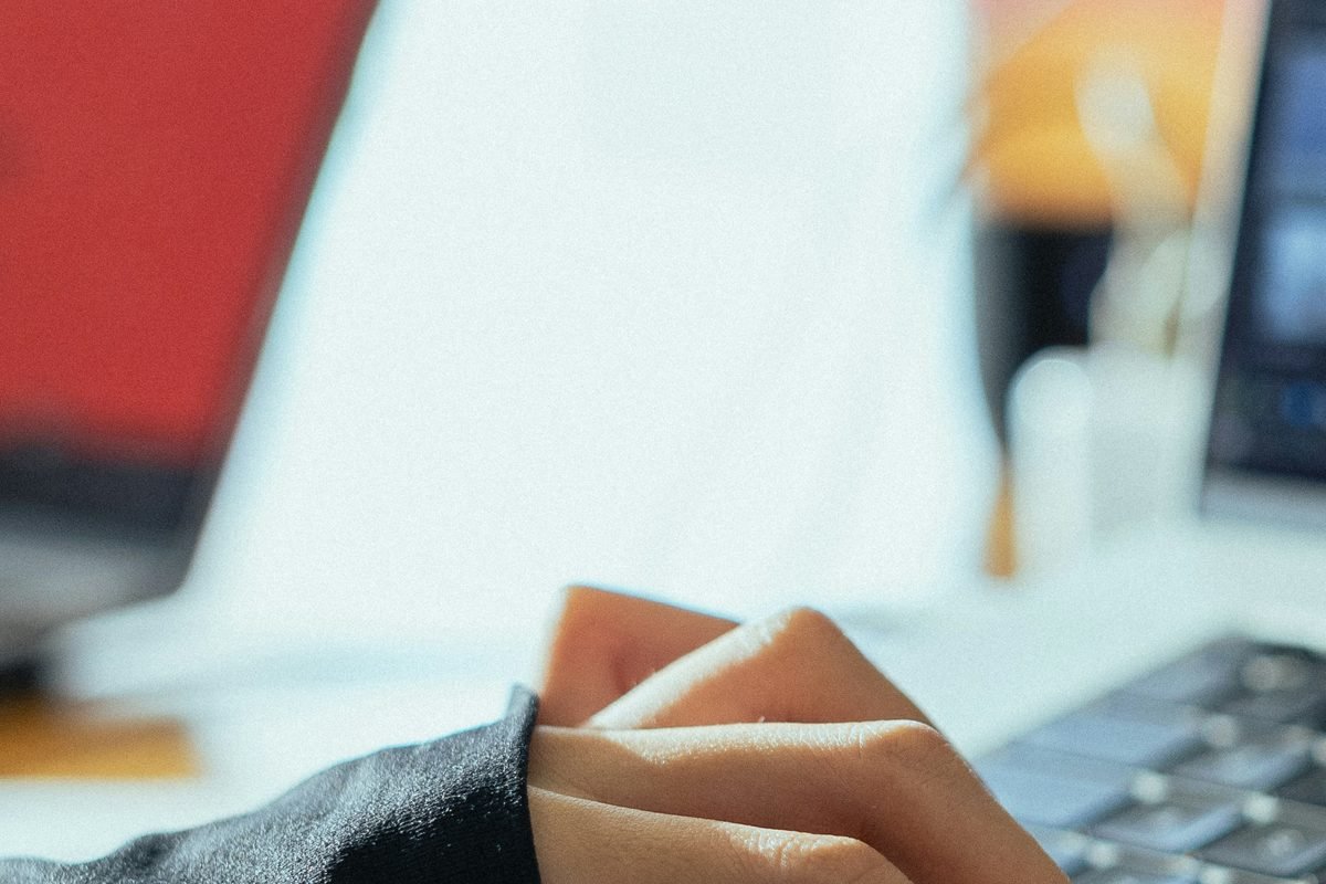 Hands at a keyboard, a common source of repetitive workplace strain